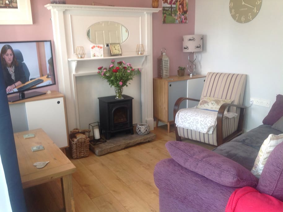 Lounge area with log burner, relax and watch the tv.