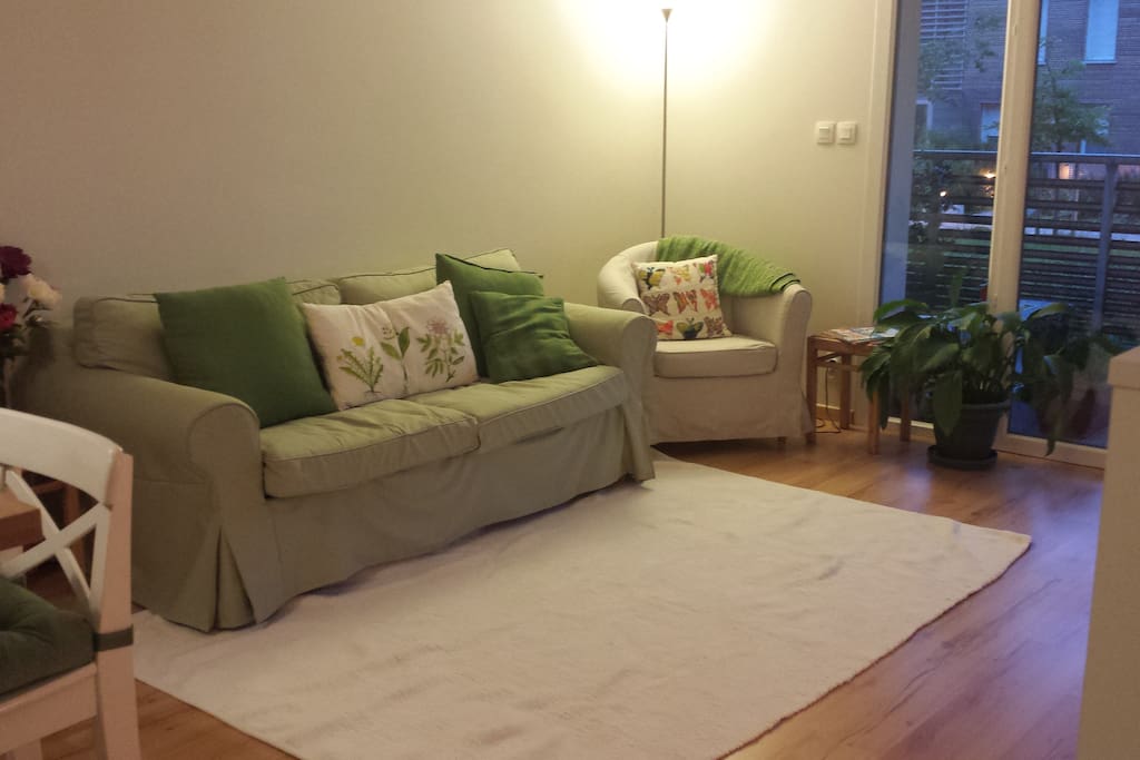 Living room with double doors opening onto the terrace