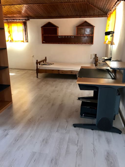 Top floor bedroom single size bed and desk