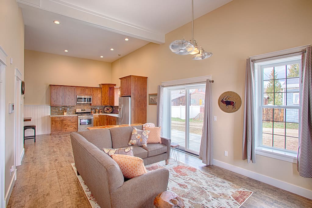 Open concept Living Room, Kitchen and Dining. Comfortable and cozy. Sliding glass door accesses private patio.