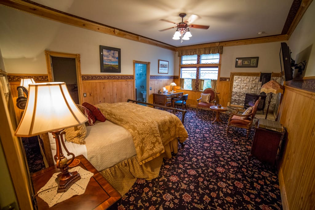 Enjoy a super comfortable California King sized bed, with gas fired wood stove, writing desk, and sitting area