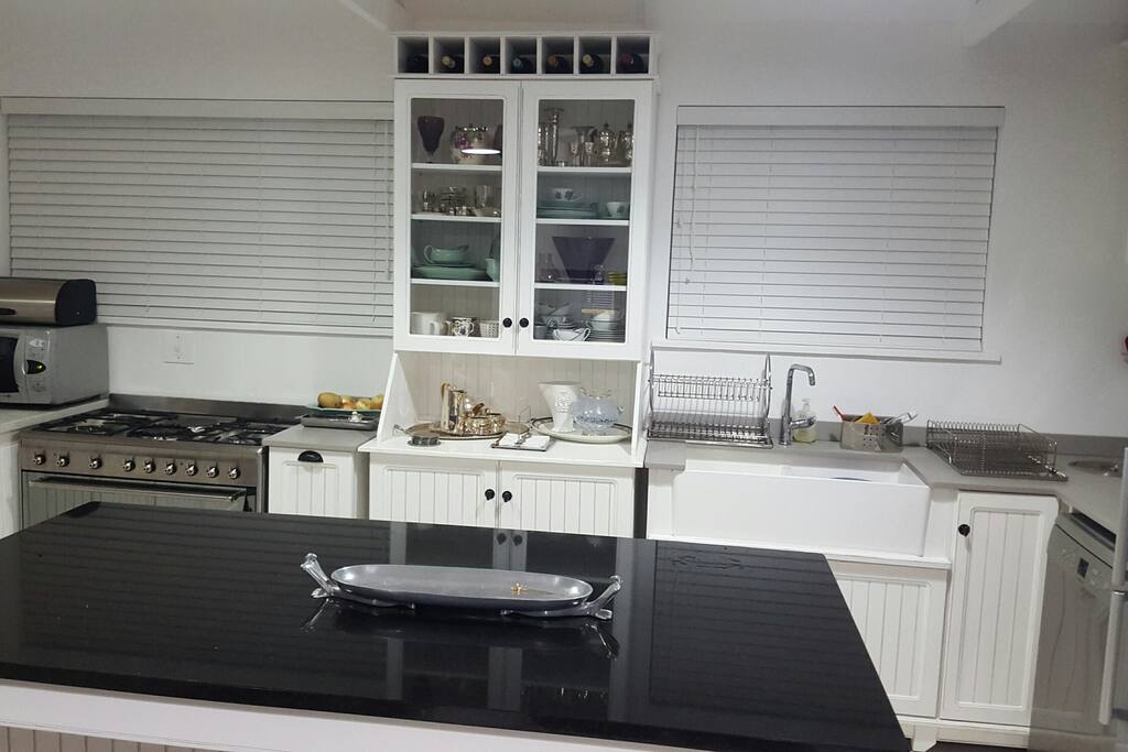 Granite and wood kitchen, well appointed, airy and light. Smeg Oven.