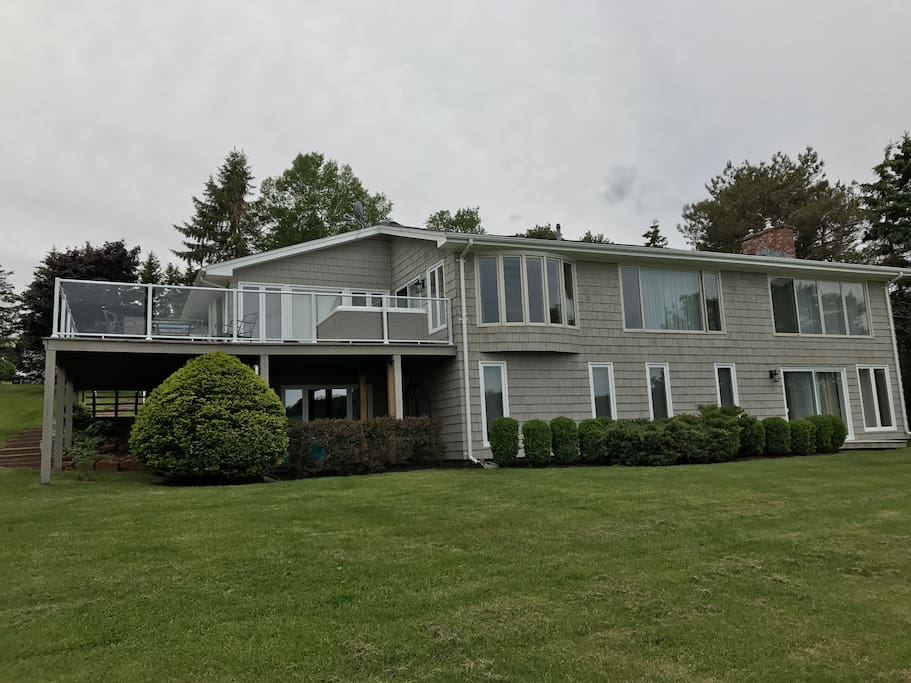 Large deck with dining set that seats six, and another lounge set to sit and relax with coffee. Hot tub on deck.