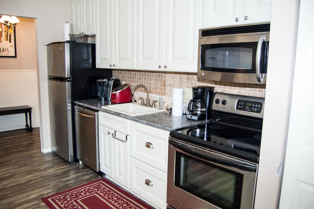 Beautifully remodeled kitchen with large appliances.
