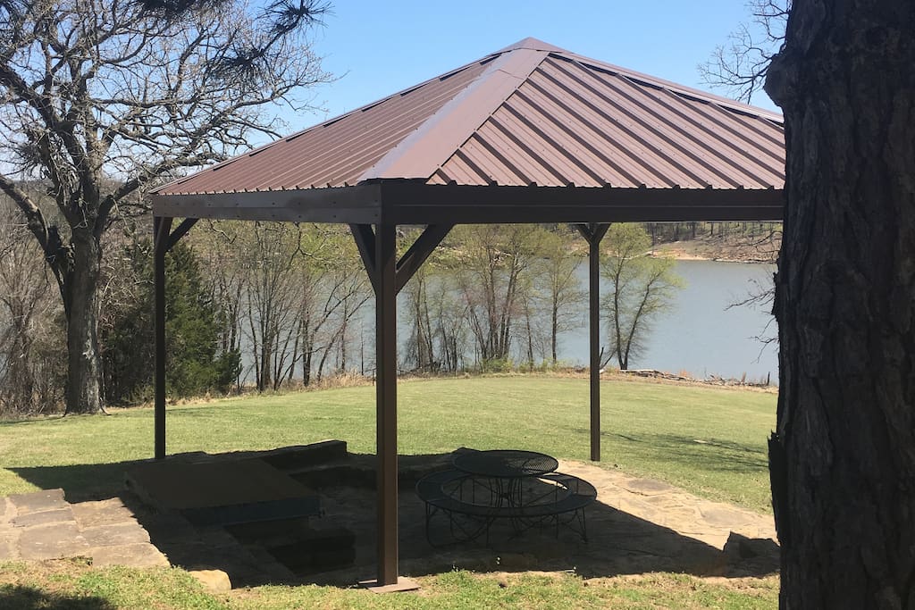 Picnic shelter next to house with winter lake view