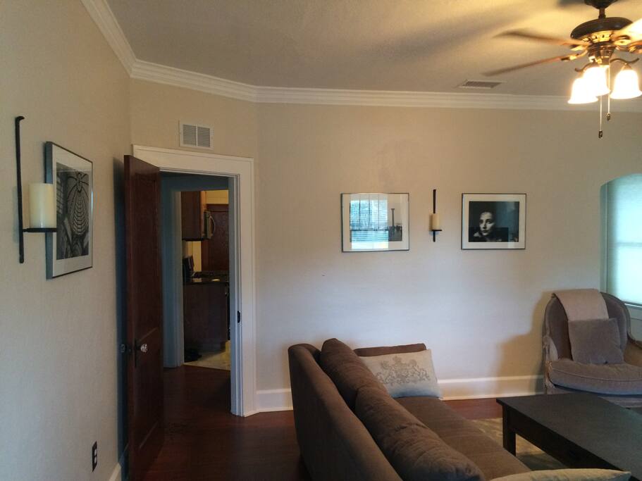 Another view of the living room leading into the hall & gourmet kitchen.