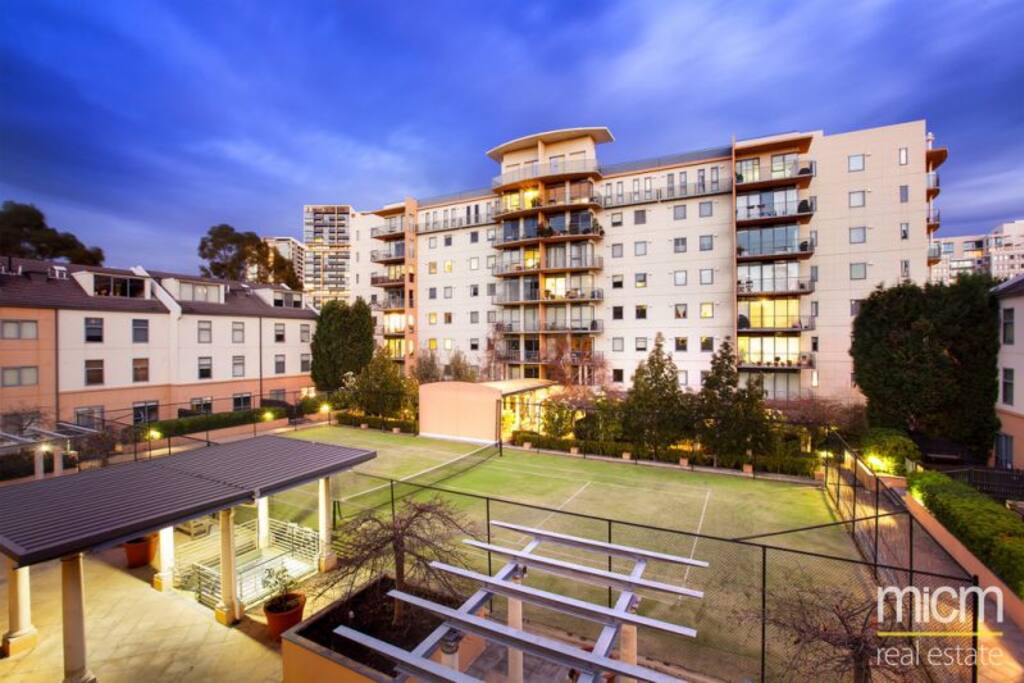 Enclosed community of low rise units and the 102 Wells St tower