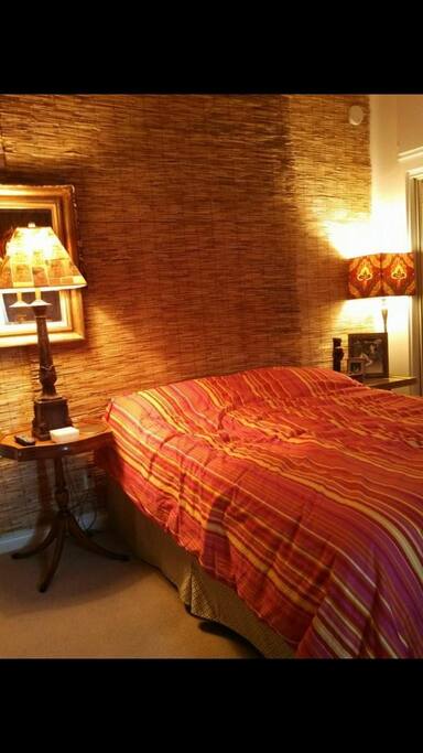Another view of your bed and nightstand