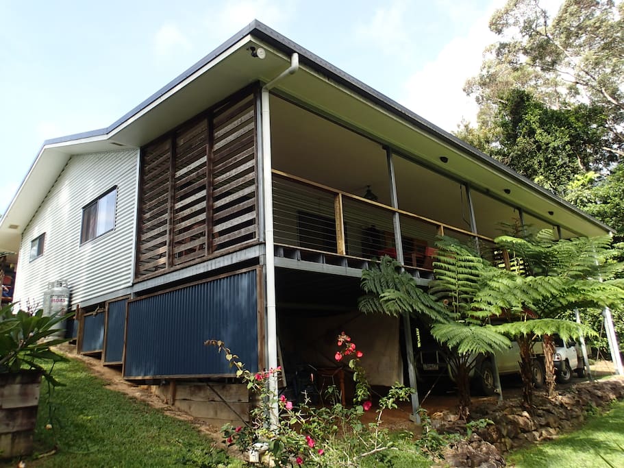 House on gentle slope high side "back veranda" with 2 car spaces under.
