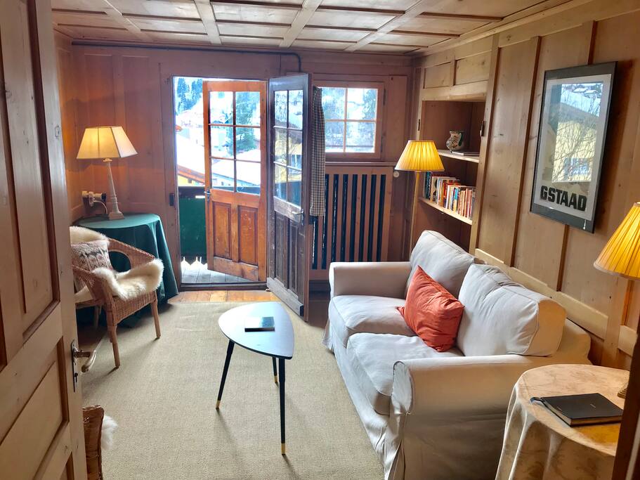 Main living room with a balcony looking out over Klosters and the mountains