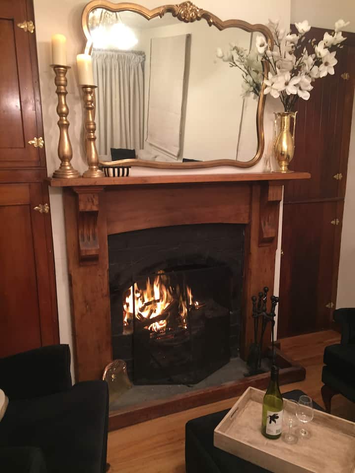 The lounge  with  an open fire has  french doors  out  the north  west  onto a  large  deck  