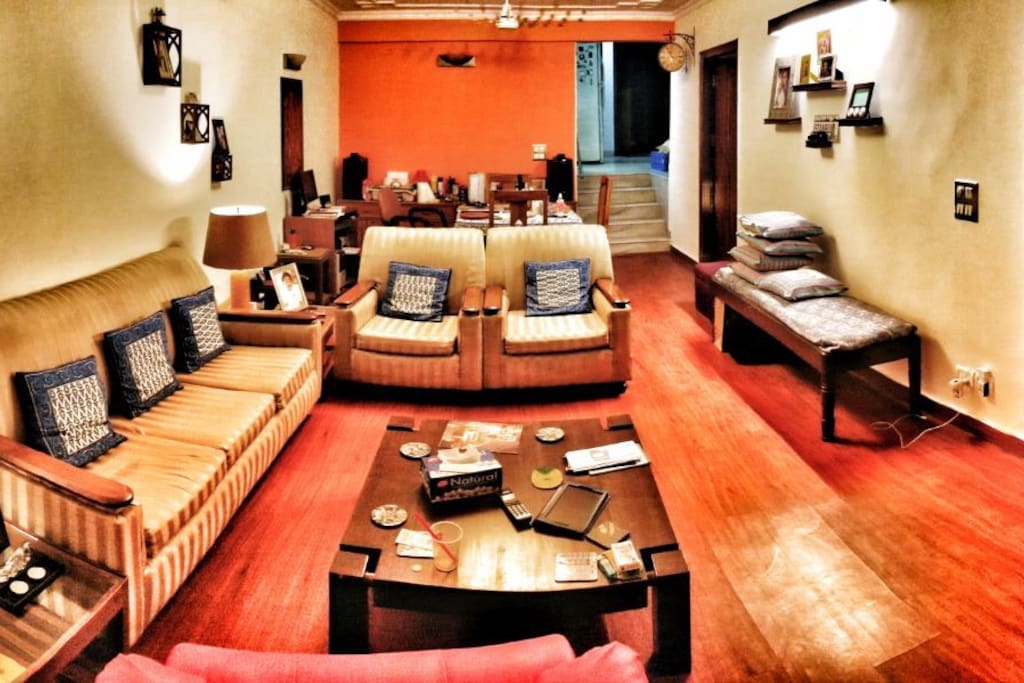 Panoramic view of the living area along with a dining table for 4 that you are welcome to use