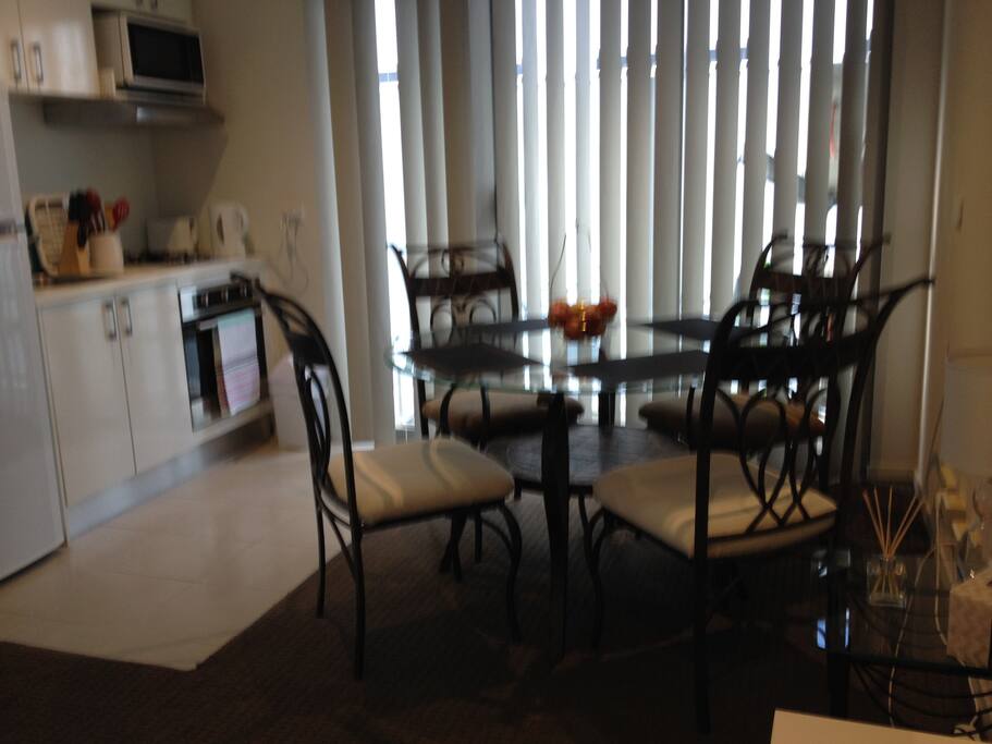 The glass dining table is a statement piece that gives a stylish look to the small apartment and makes your dining experience more elegant.