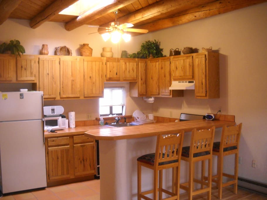 Full kitchen with breakfast bar for 3.