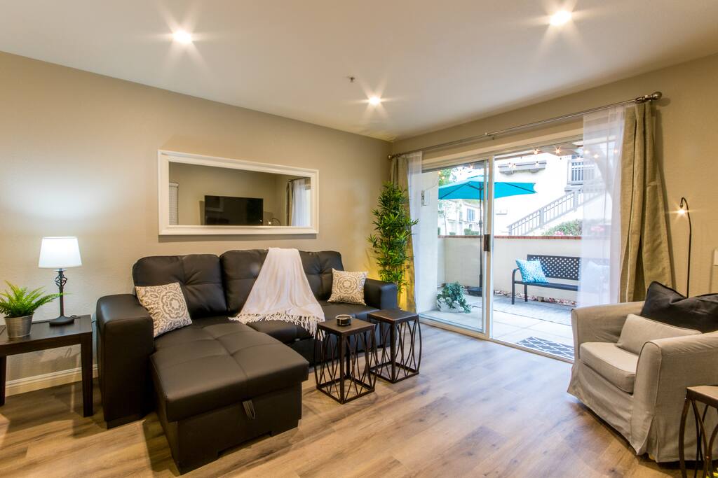 You will love this cozy and modern Living Room furnished with a sectional sleeper sofa that opens up to a full size bed.