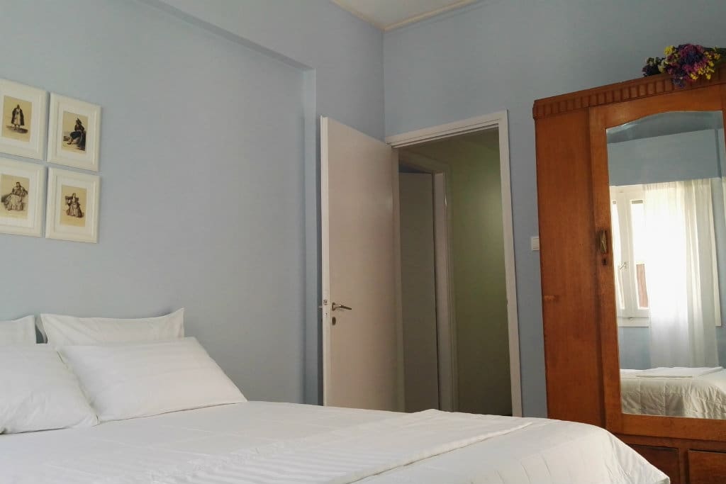 Comfortable sunny bedroom with luxury linen and mattress