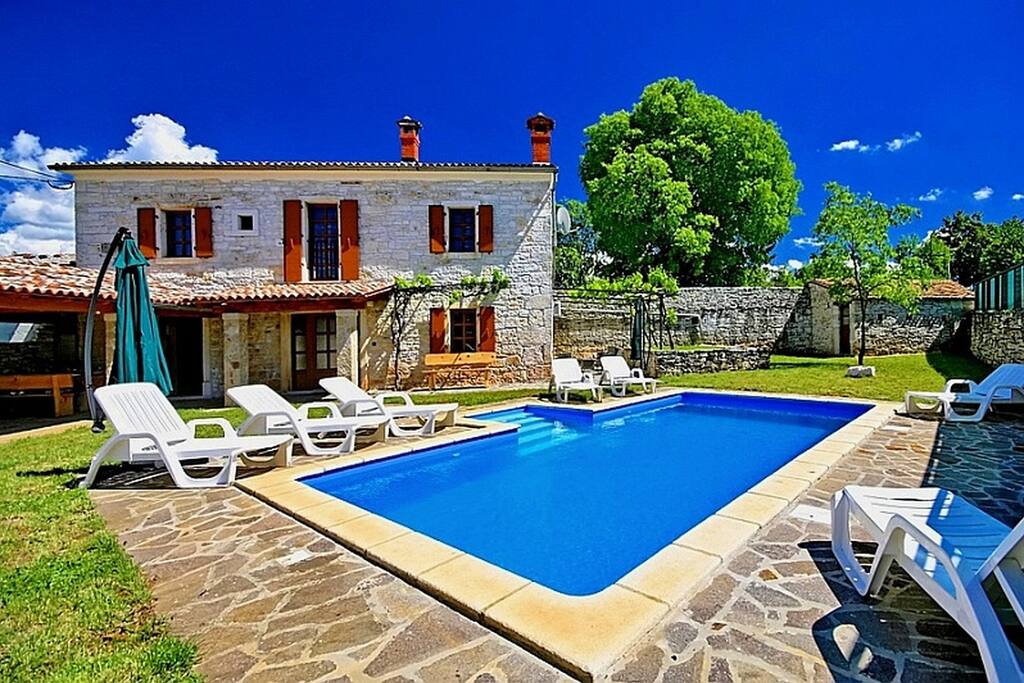 Sun chairs by the swimming pool
