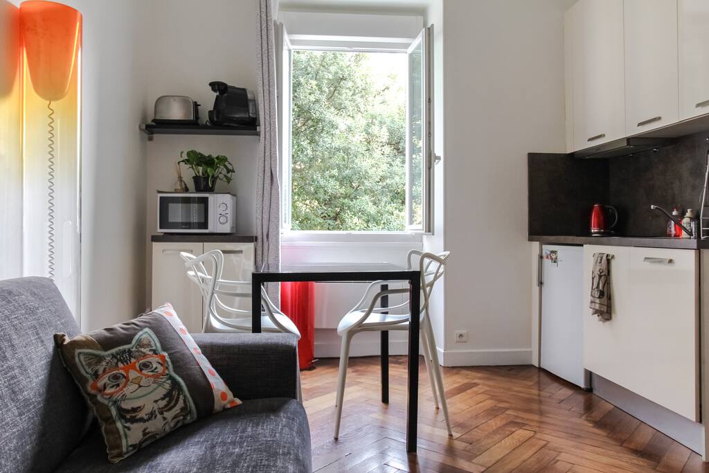 the dining living room with a nice green garden view