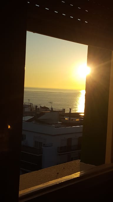 The room has a view of the sunrise and the ocean