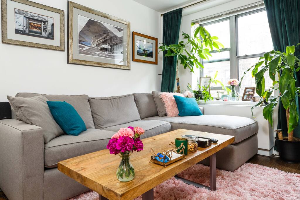 Relax on the Room & Board chaise sofa in the well-lit living room.