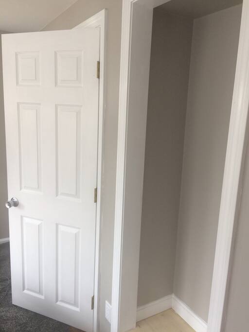 Room with door lock and closet.