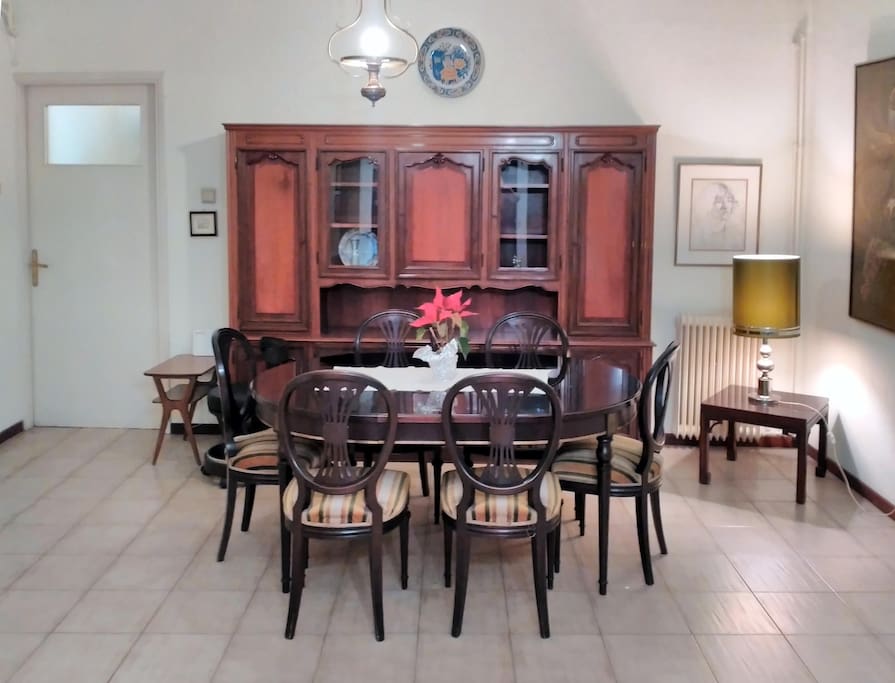 Dining area with retro solid wood furniture.