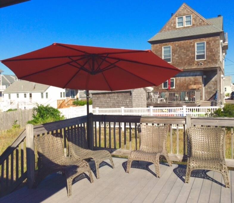Back deck - offset umbrella, grill, seating and lounging. Best coffee spot ever.