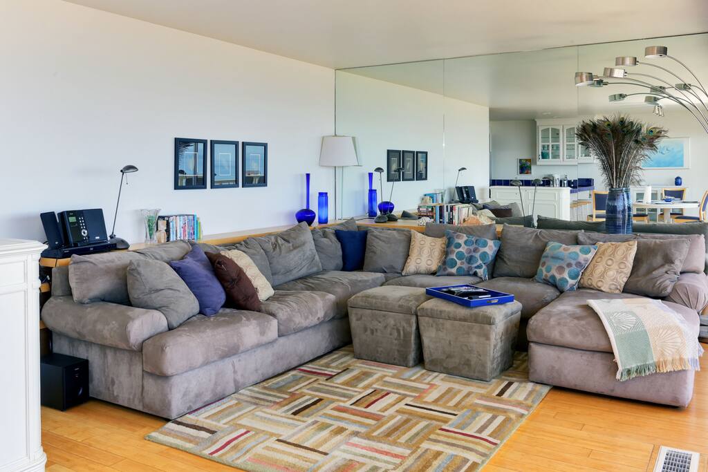 Comfy, bright living room for relaxing after a day at the beach.
