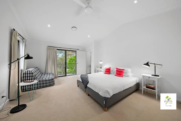 Upstairs Master Bedroom 2 with king bed, balcony, dam view and an ensuite