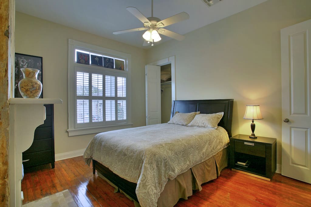 Queen bed, aromire, closet, side table.