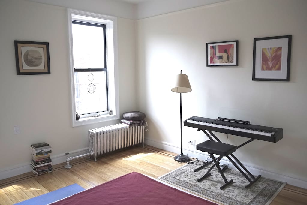Bedroom with piano