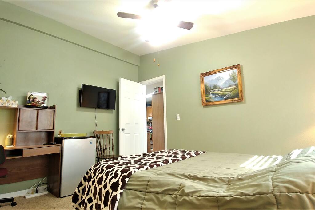 Your room also includes a tv, work desk, chair, fridge, and closet