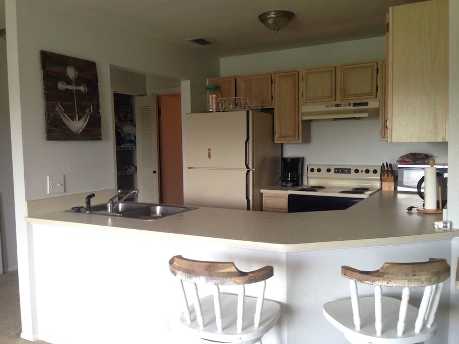 Open kitchen to living room with breakfast bar