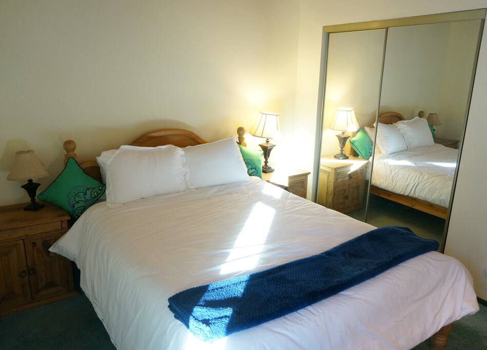 Bedroom with comfortable queen bed.