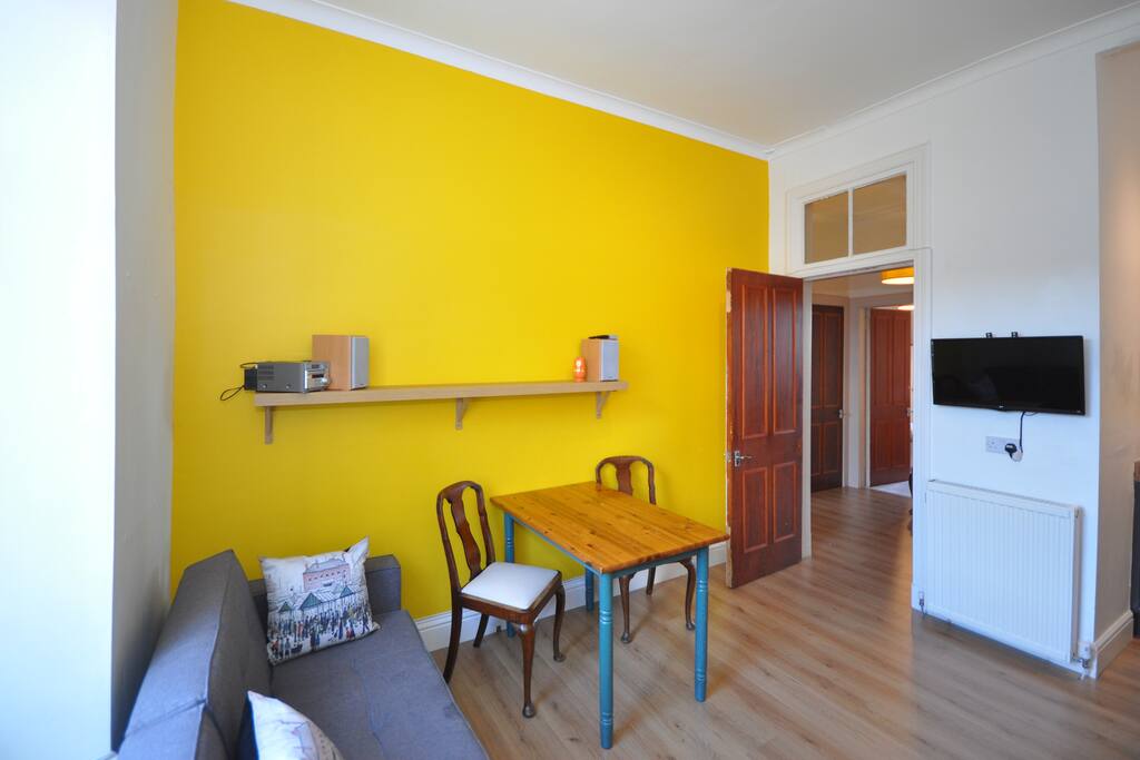 Kitchen with television on wall, 150 channels.