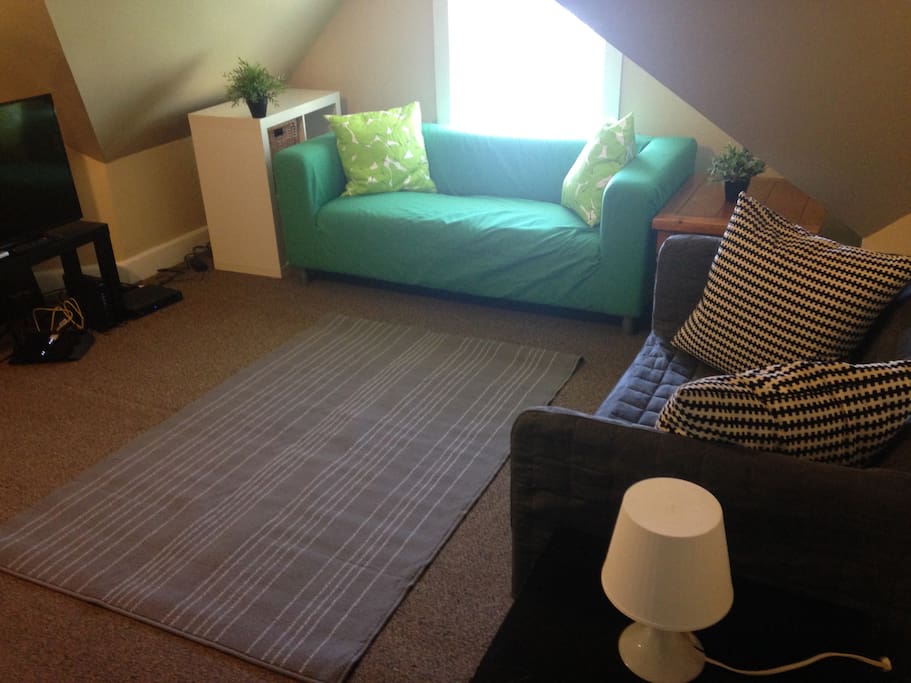 This is the bedroom when it is not in use it doubles as a living room.