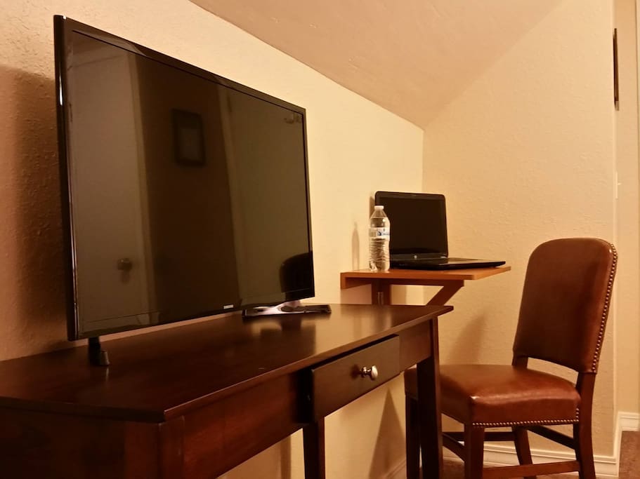 Are you here for work? We wish you luck, as this smart TV sits right in front of your super comfy bed.