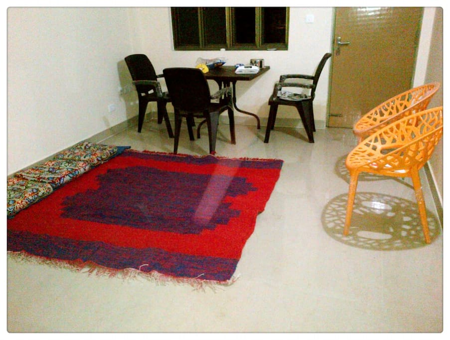 Hall with Dinning set, floor carpet and seating