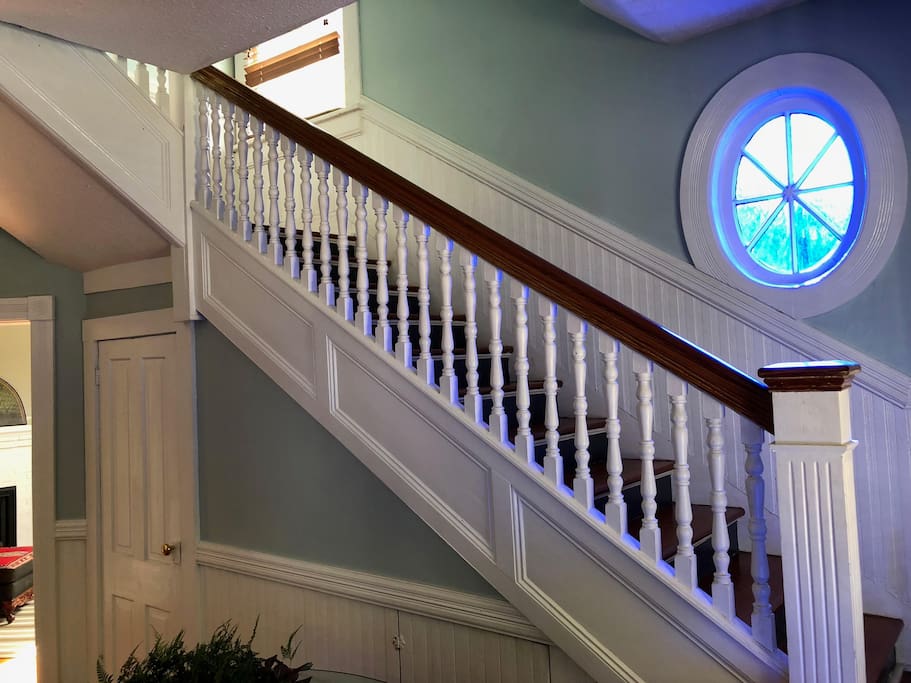 Staircase featuring some of the oldest stained glass in Glynn County