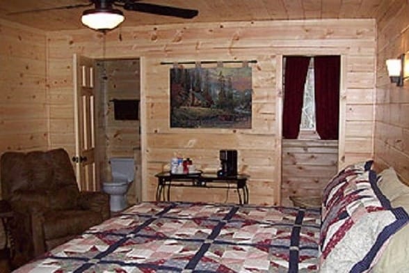 Upstairs master bedroom w/ king bed, adjoining full bathroom, walk in closet & coffee bar.