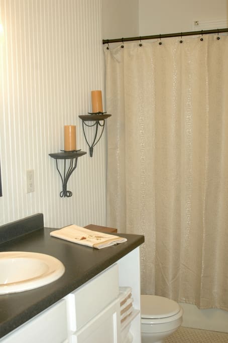 The bathroom is large with deep soaking tub and shower