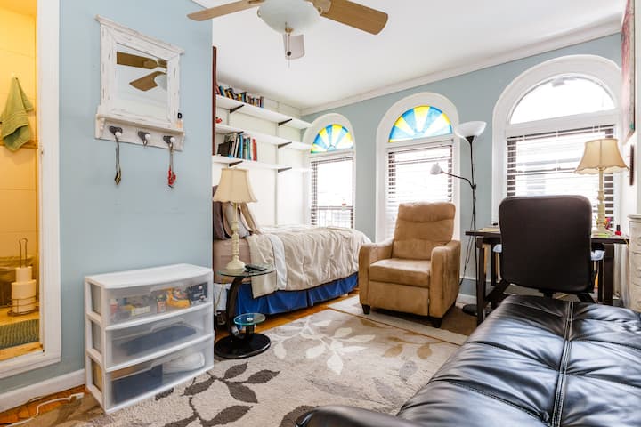 This large airy room overlooking Times Square has cathedral windows, ceiling fan, air conditioning, your own separate reading area,futon/bed and a wall mounted TV!  You also get to enjoy the convenience of your own private fully equipped bathroom.  