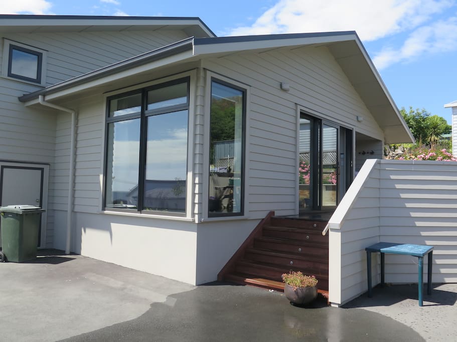 To the deck and your room from the driveway