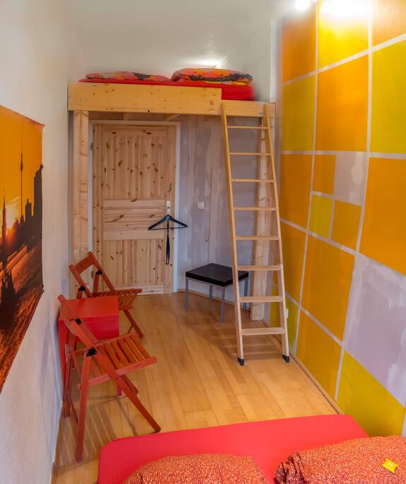 The room. Above the door: the elevated surface with a bed for two.
Photo: (C) Jan Biskup