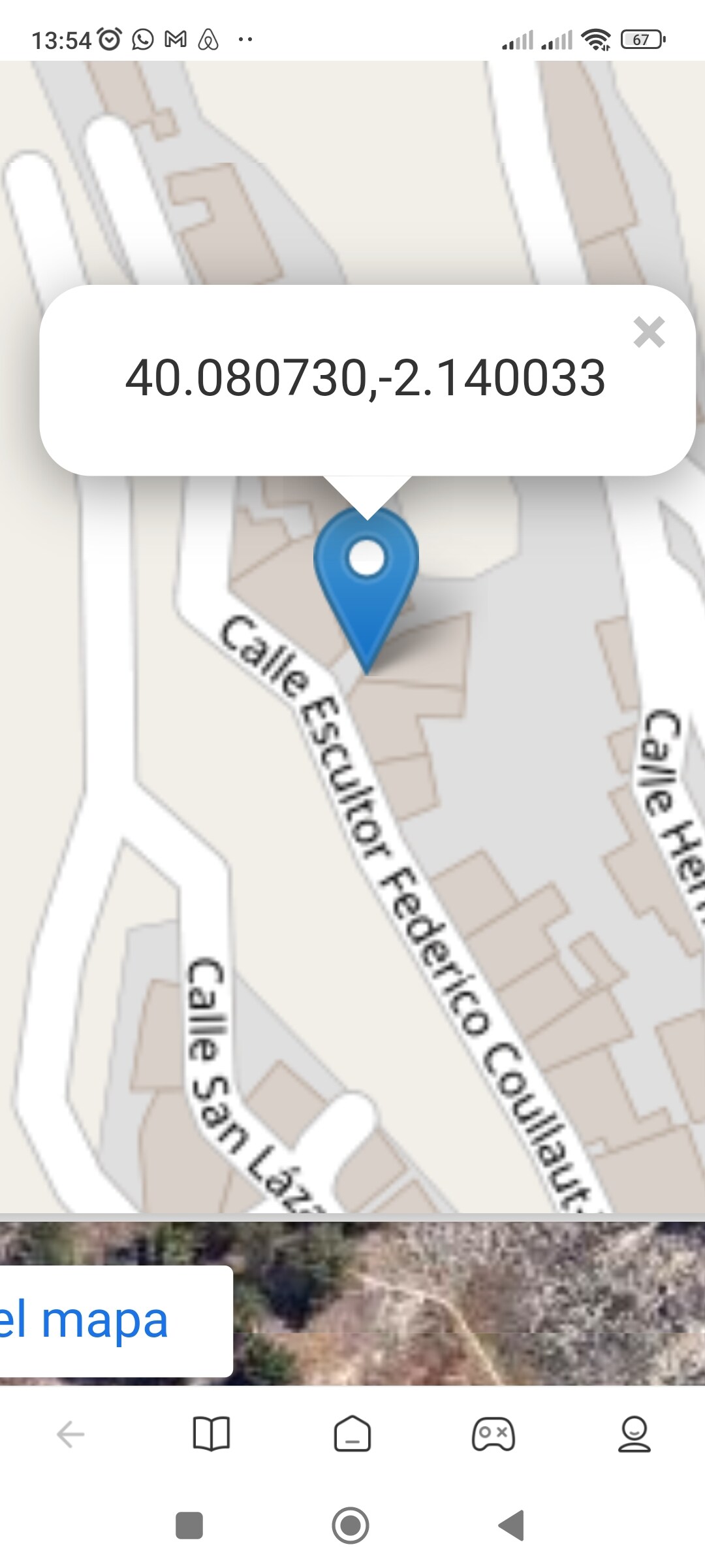 A digital map displays street names and a location marker. The area is identified as Calle Escritor Federico Coullaut, with pathways and neighboring streets indicated. The layout outlines the surroundings, providing a sense of the neighborhood's organization.