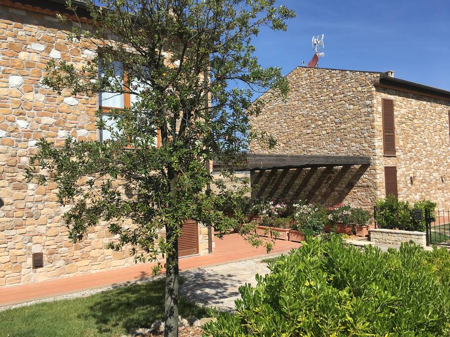 apartment building with garden and terrace