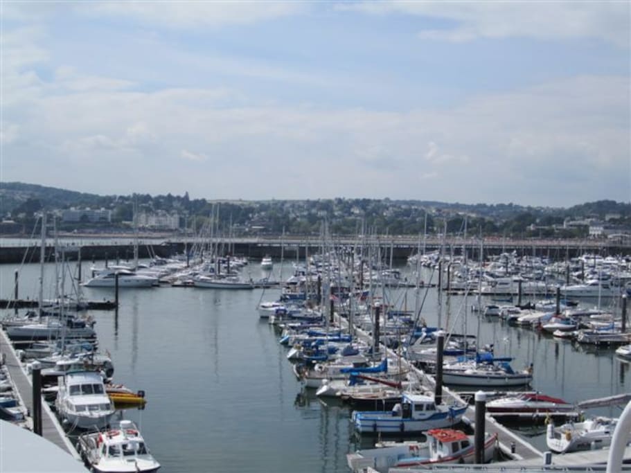 The marina with cafes is just yards away, though not visible from the flat