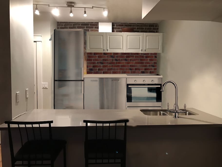 Fully equipped modern stainless steel kitchen