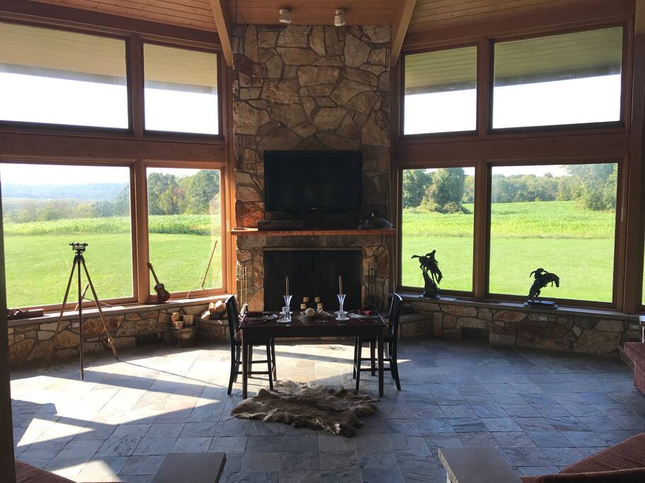Our great room is fantastic for hosting your next weekend getaway with 21ft cathedral ceilings, magnificent floor to ceiling windows and stunning views of rolling hills, wildlife and Hudson River. This room can be transformed to seat dinner parties up to 37 people. Please ask for more details.