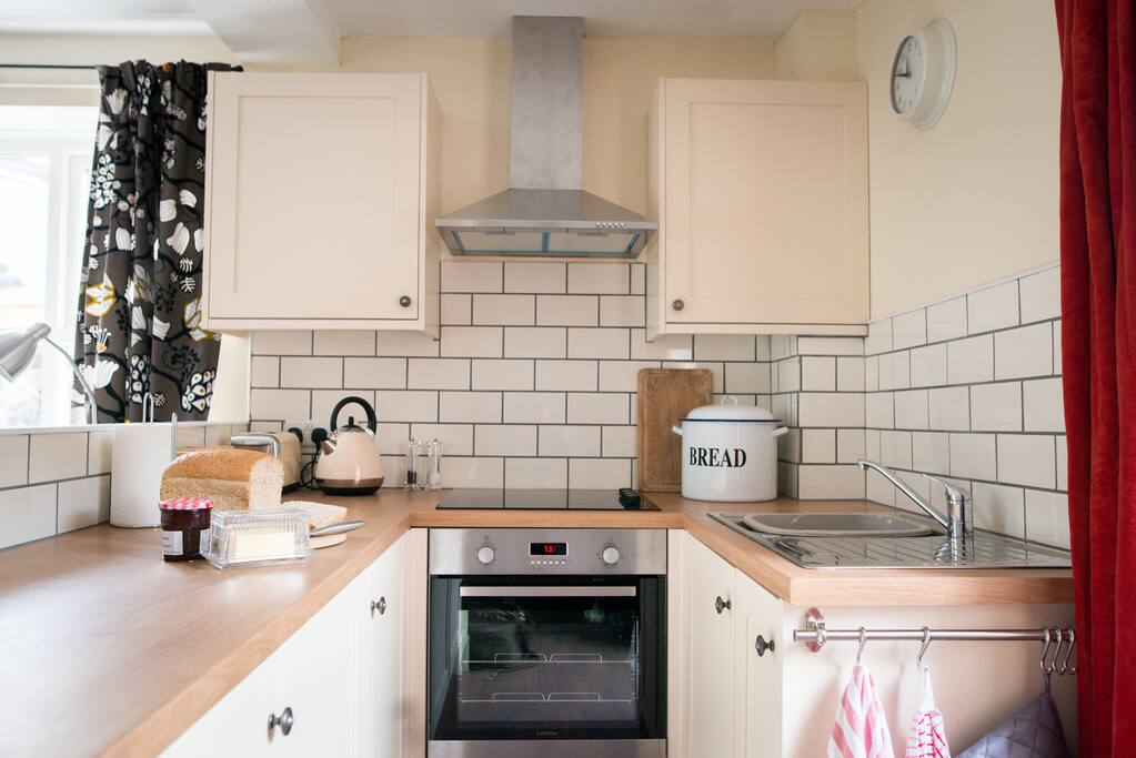 Fully fitted and well equipped kitchen with integrated cooker and fridge.